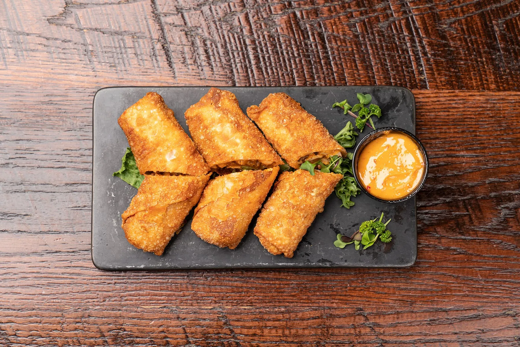 Stinger egg rolls with a creamy chili sauce
