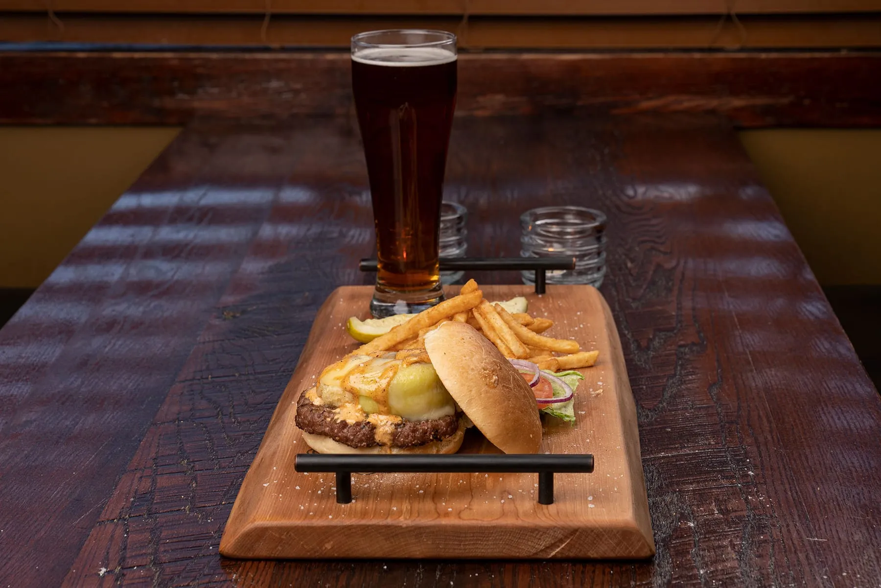Cheeseburger with fries and a beer