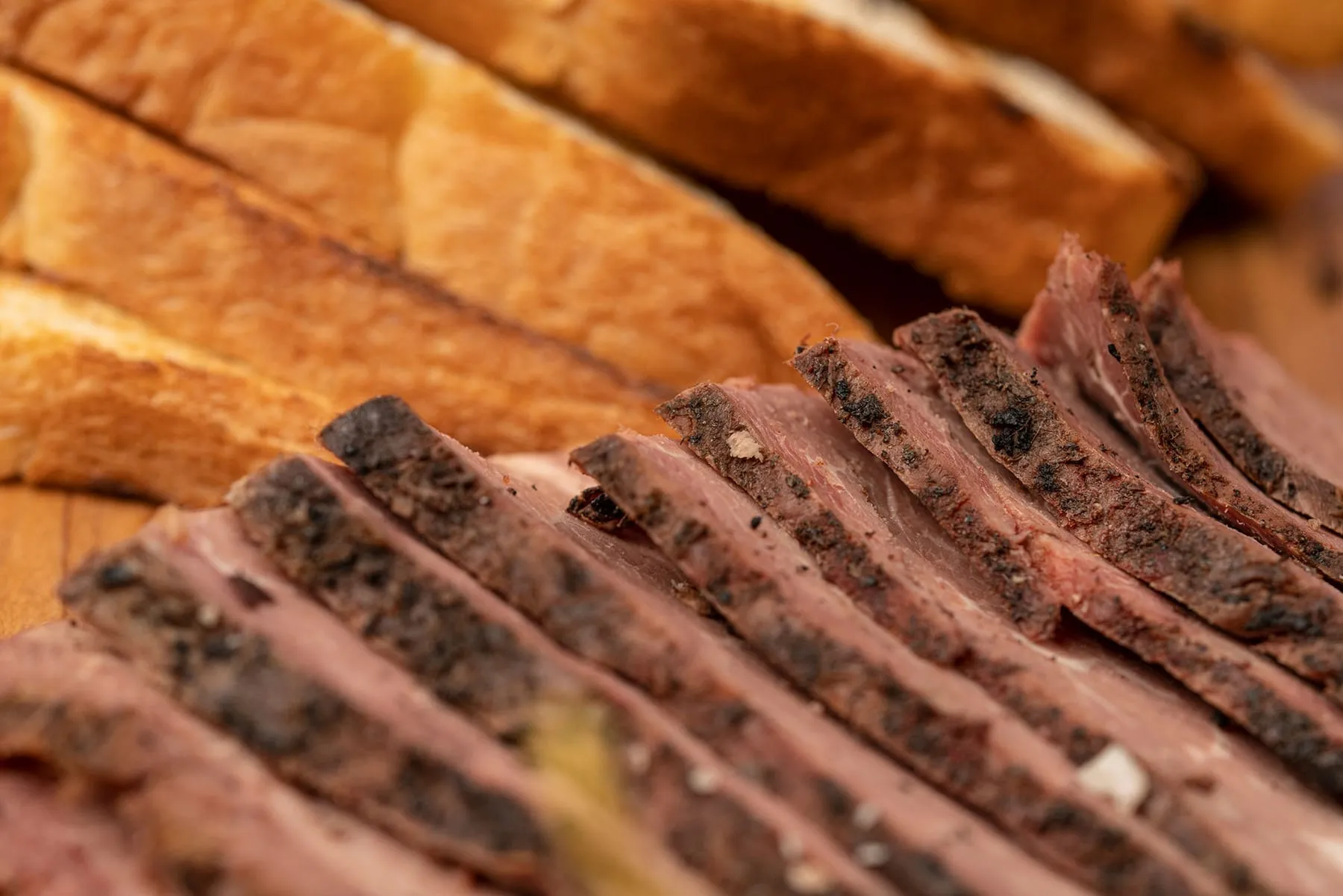 Sliced house-smoked beef brisket and bread